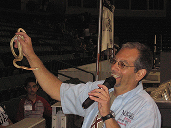 Dennis Ferraro holding snake at presentation